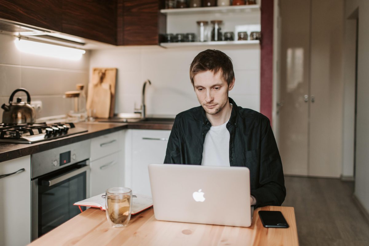 Man working from home at his kitchen table